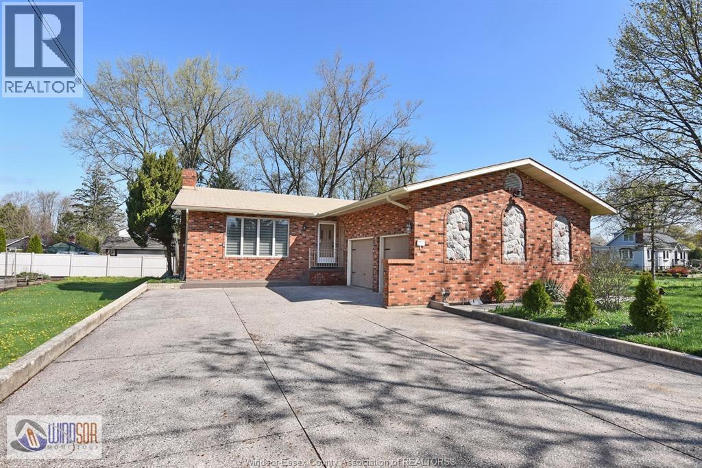 A house with a driveway in front of it.