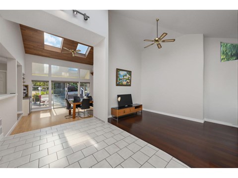 A living room with a television and a chair.