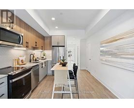 A modern kitchen with a dining table and chairs.