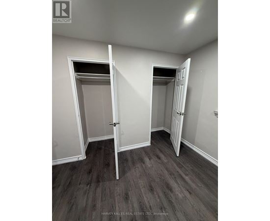 A brokerage office with two open doors.
