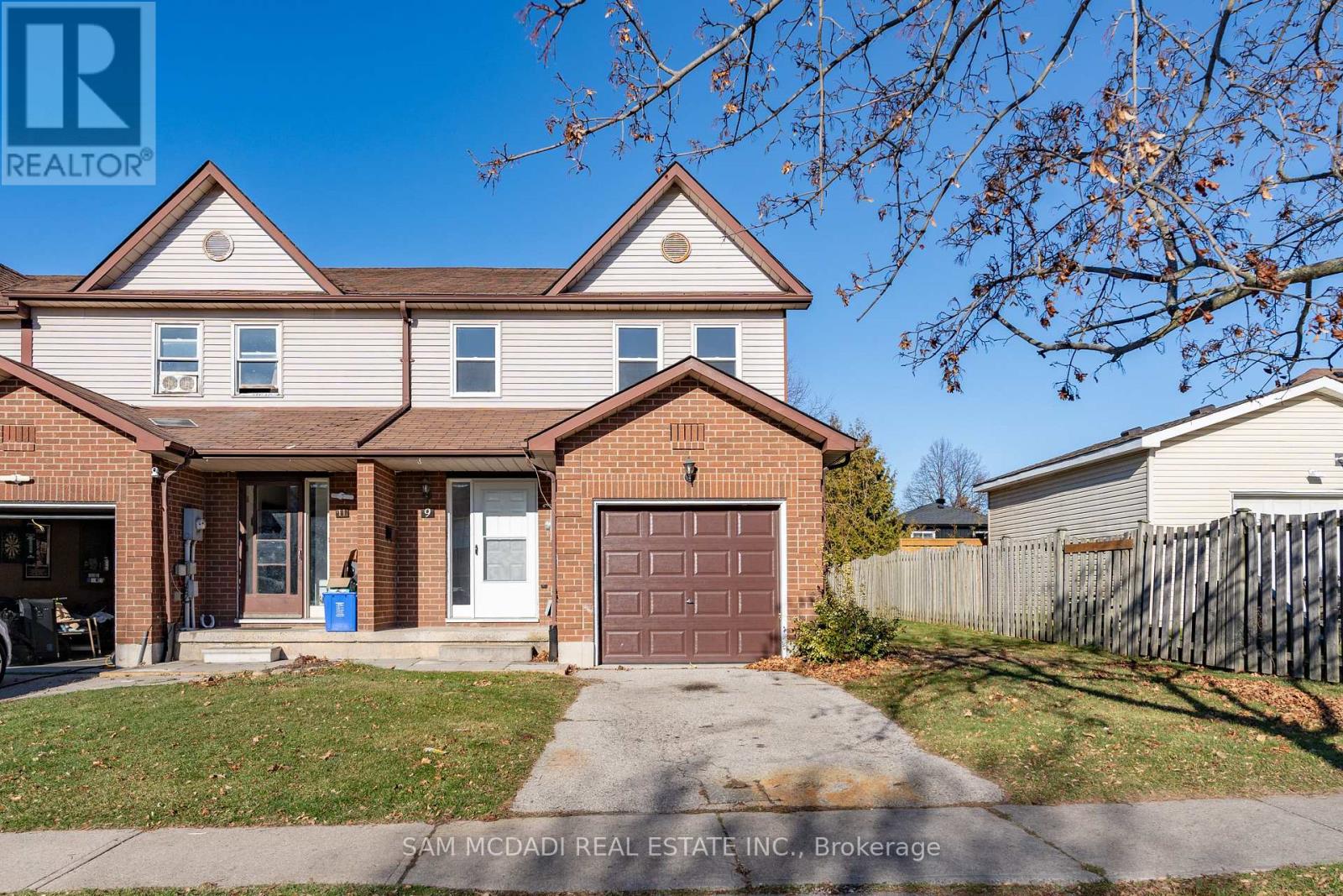 A house with a brown garage door is for sale.