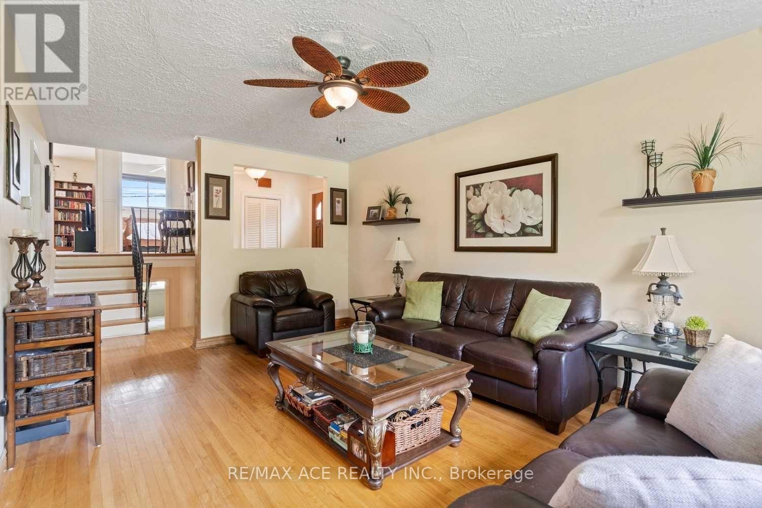 A living room with a brown leather couch and a coffee table.
