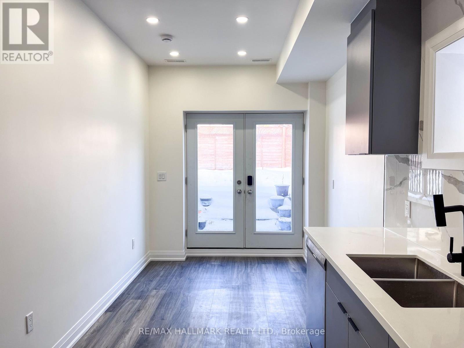 A kitchen with a sink and a window.