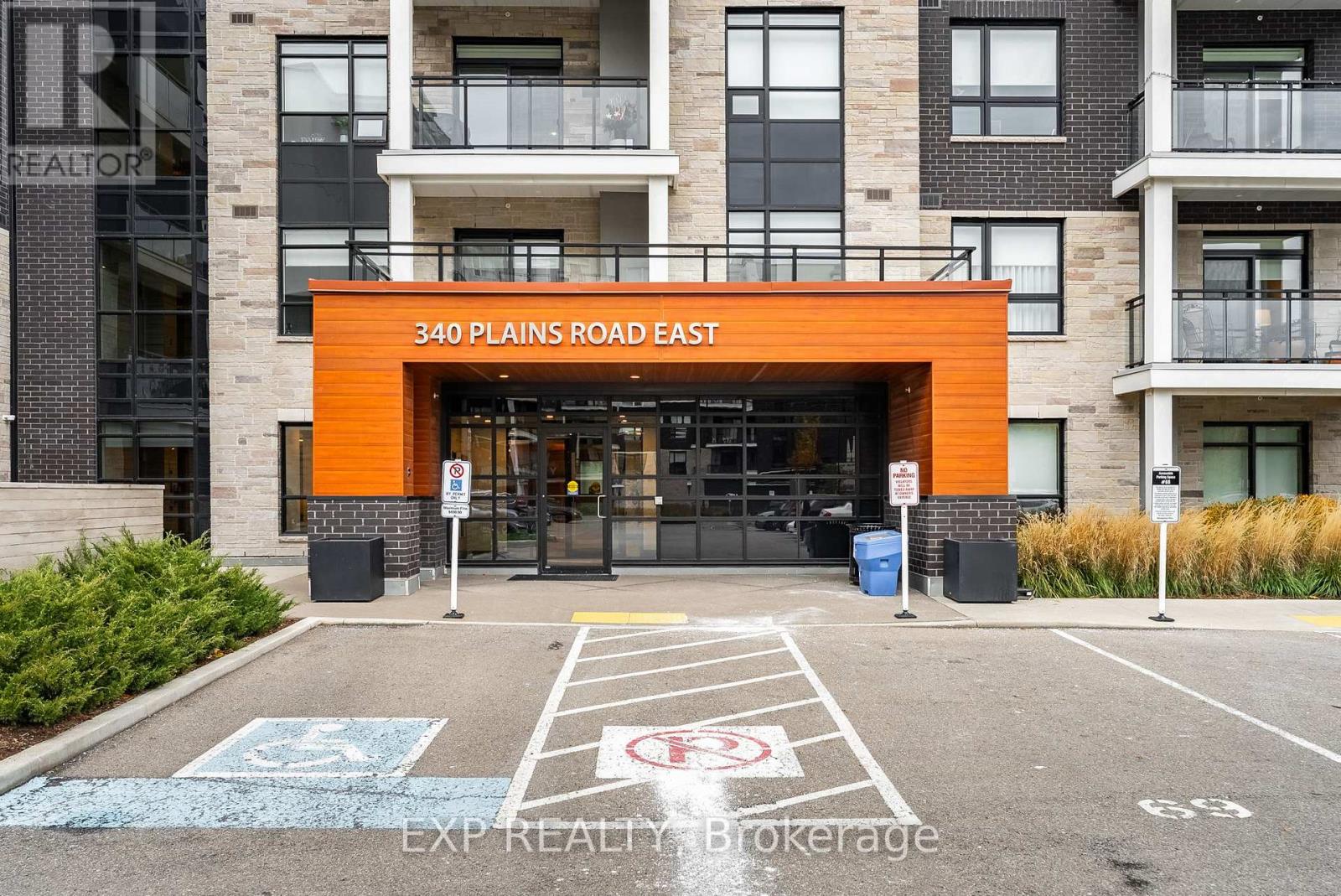 The entrance to a building with a sign that reads "340 Plains Road East".