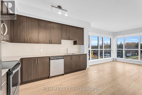 A kitchen with wooden cabinets and a dishwasher.