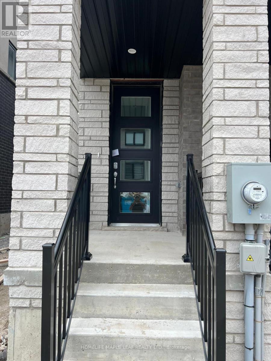 A black door is at the end of a staircase.