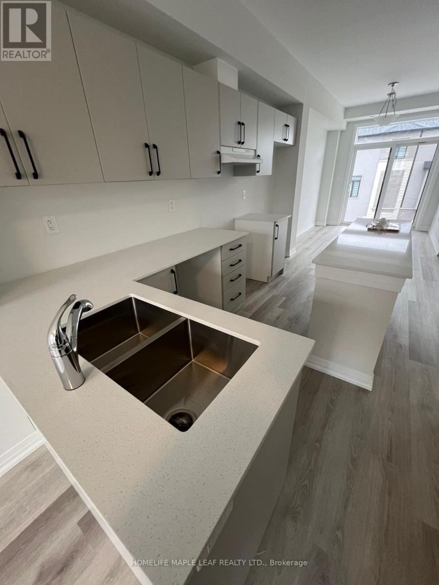A modern kitchen with a sink and cabinets.