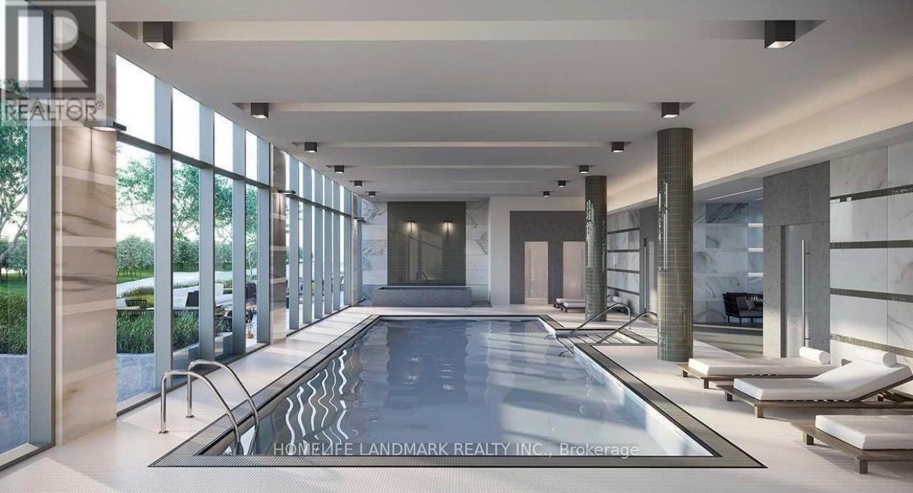 A large indoor swimming pool with a glass wall on one side.