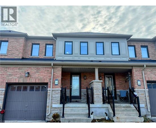 A house with a brick facade and a grey roof.