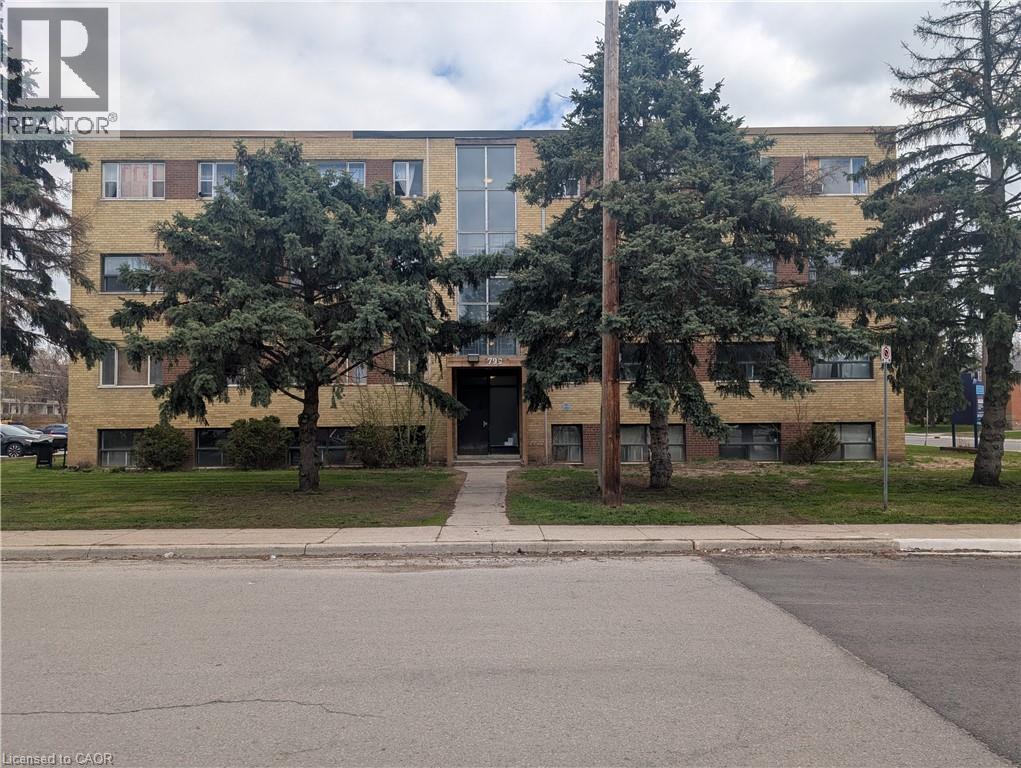 A building with a tree in front of it.