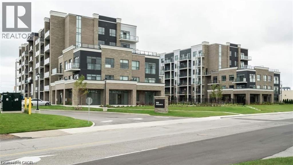 A large apartment complex with a sign that says REALTOR.