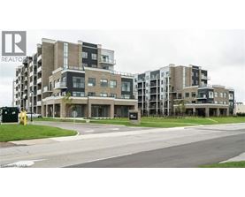 A large apartment complex with a sign that says REALTOR.