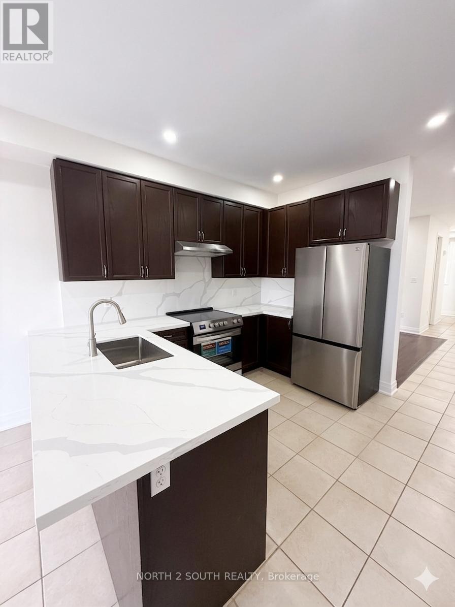A kitchen with brown cabinets and a white counter top.