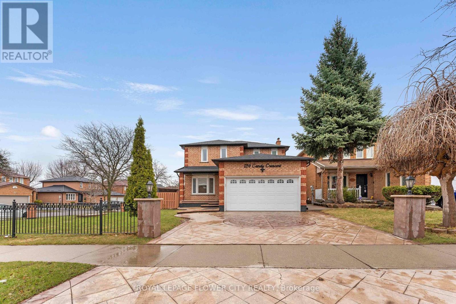 A large house with a driveway in front of it.