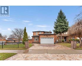 A large house with a driveway in front of it.