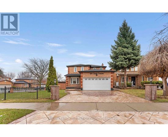A large house with a driveway in front of it.