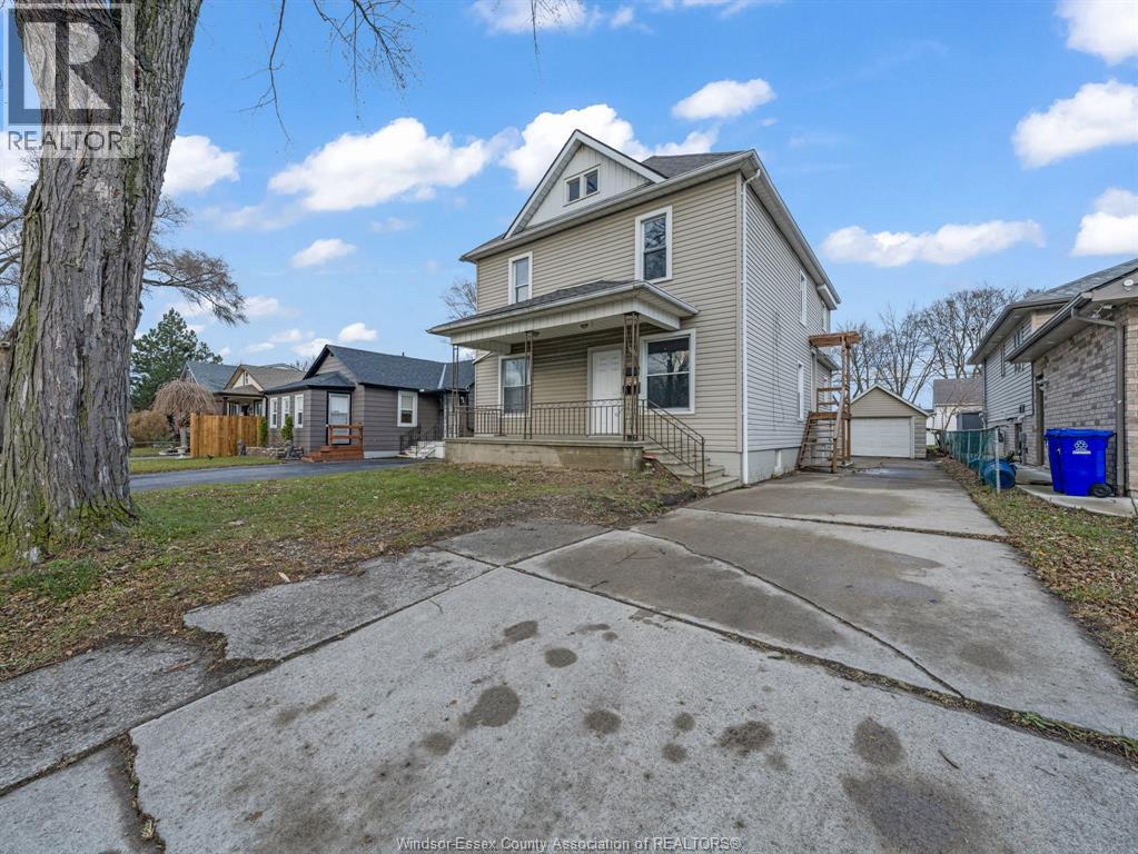 A house with a driveway in front of it.