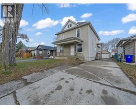 A house with a driveway in front of it.