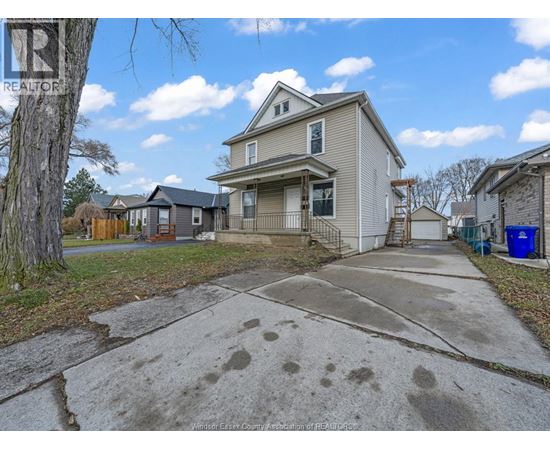 A house with a driveway in front of it.