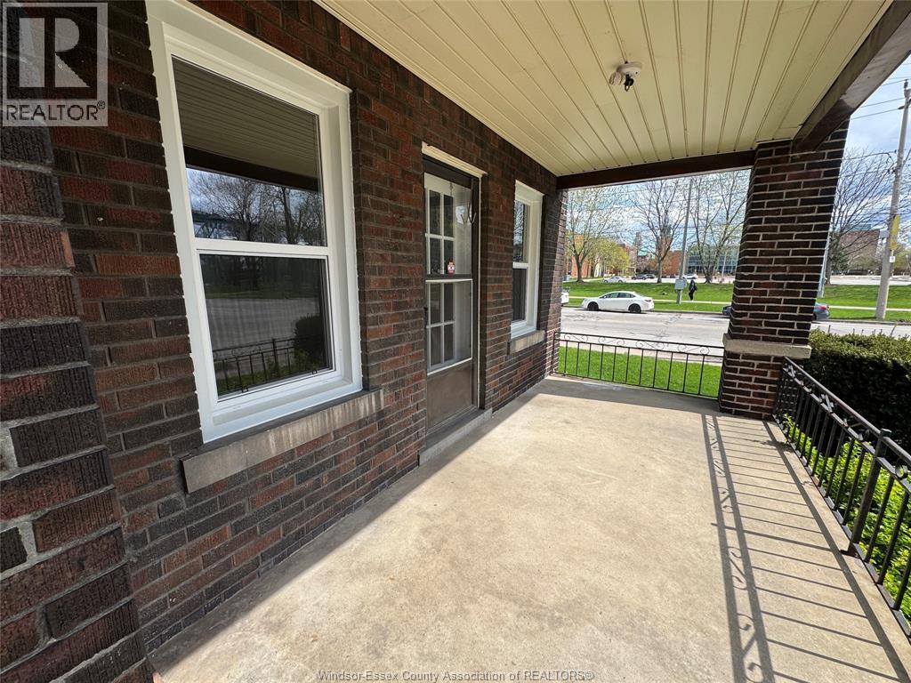 A house with a realtor sign on the wall.