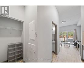 A white room with a door leading to a balcony.