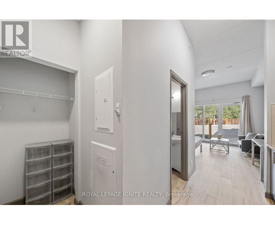 A white room with a door leading to a balcony.
