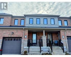 A house with a brick facade and a garage door is for sale.