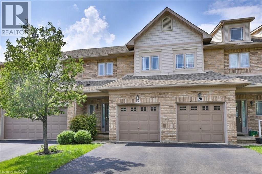 A large house with a tree in front of it.