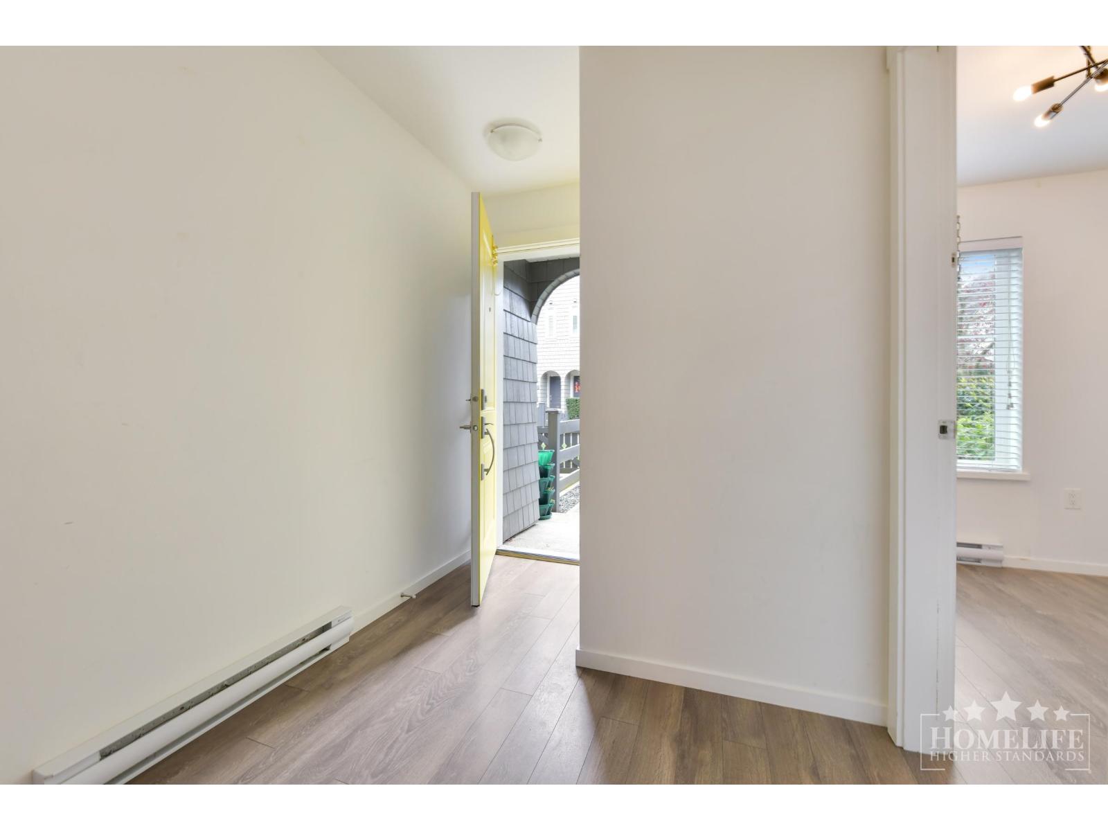 A room with a doorway leading to another room.
