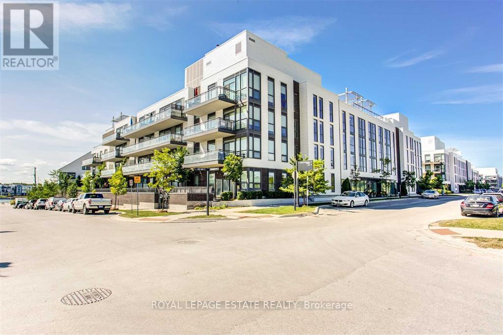 A street view of a multi-story building with the logo "REALTOR" on the top left corner.