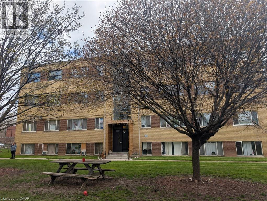 A large building with a tree in front of it.