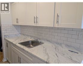 A kitchen with a sink and cabinets.