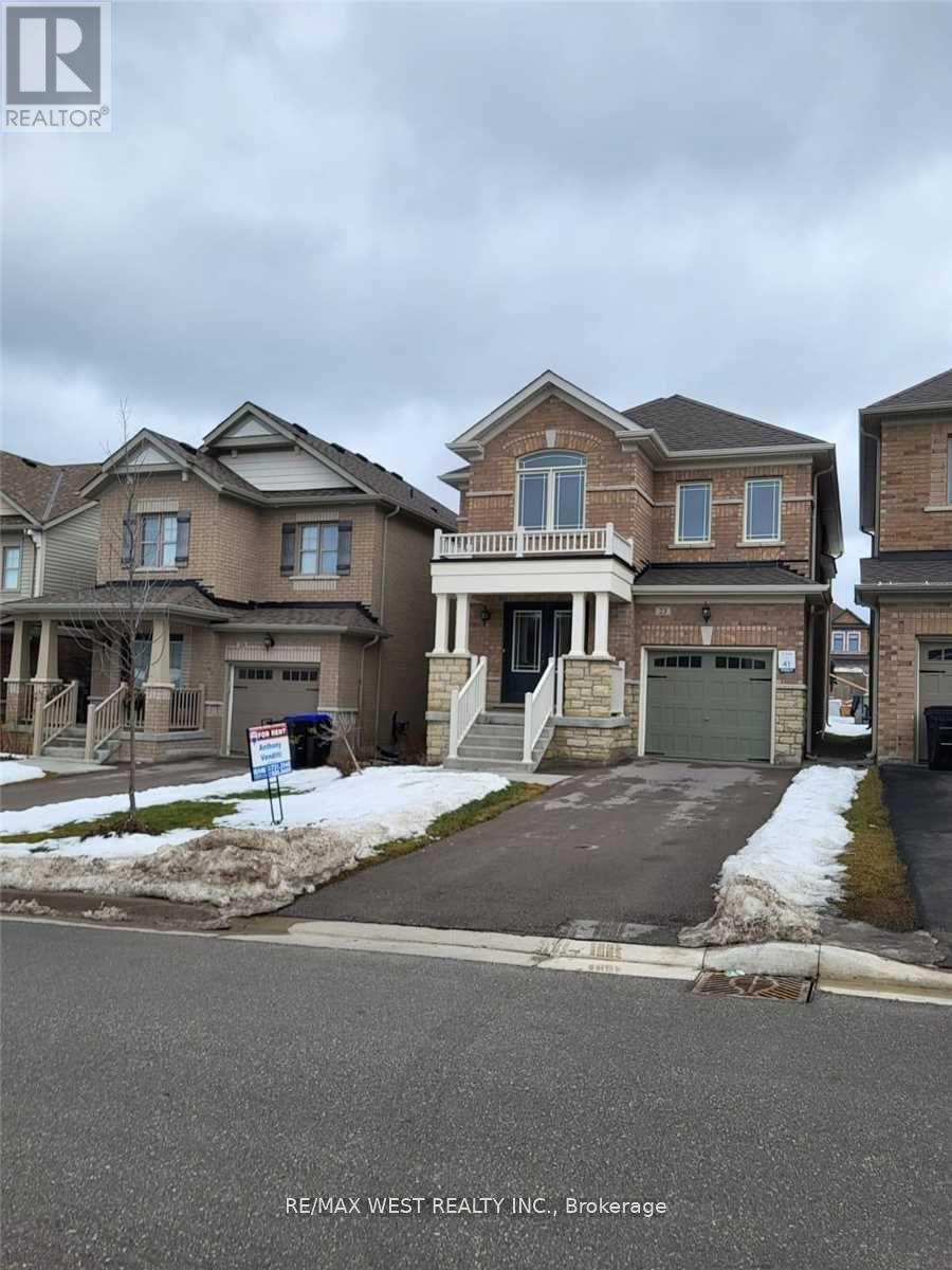 A row of houses with a sign in front of the first one.