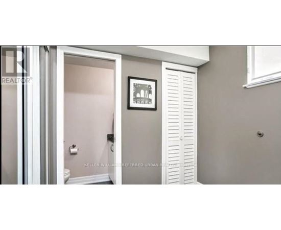A bathroom with a toilet and a white door.