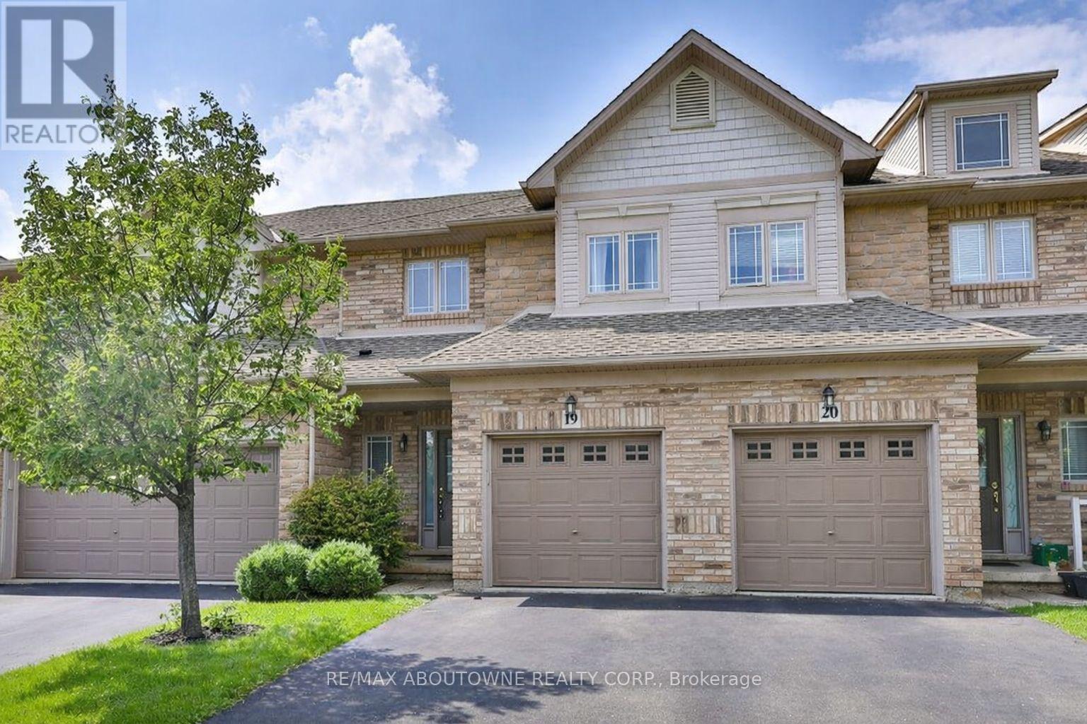 A large house with a tree in front of it.