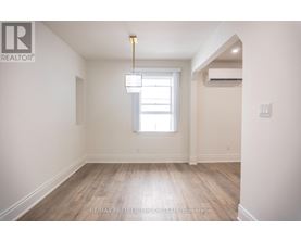 A room with a window and a light fixture.