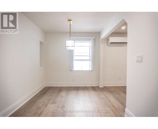 A room with a window and a light fixture.