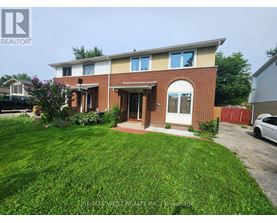 A house with a red brick facade and a white door is for sale.