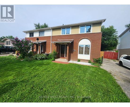 A house with a red brick facade and a white door is for sale.