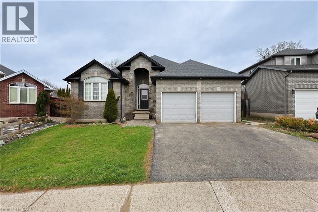 A large house with a driveway in front of it.