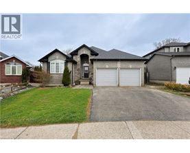 A large house with a driveway in front of it.