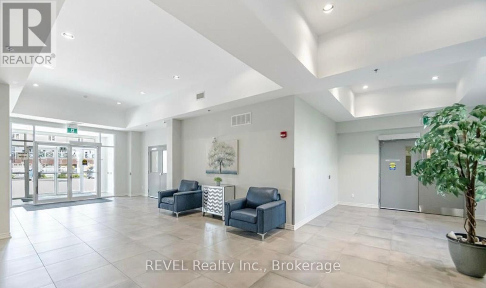 A spacious lobby area with a reception desk and comfortable seating.