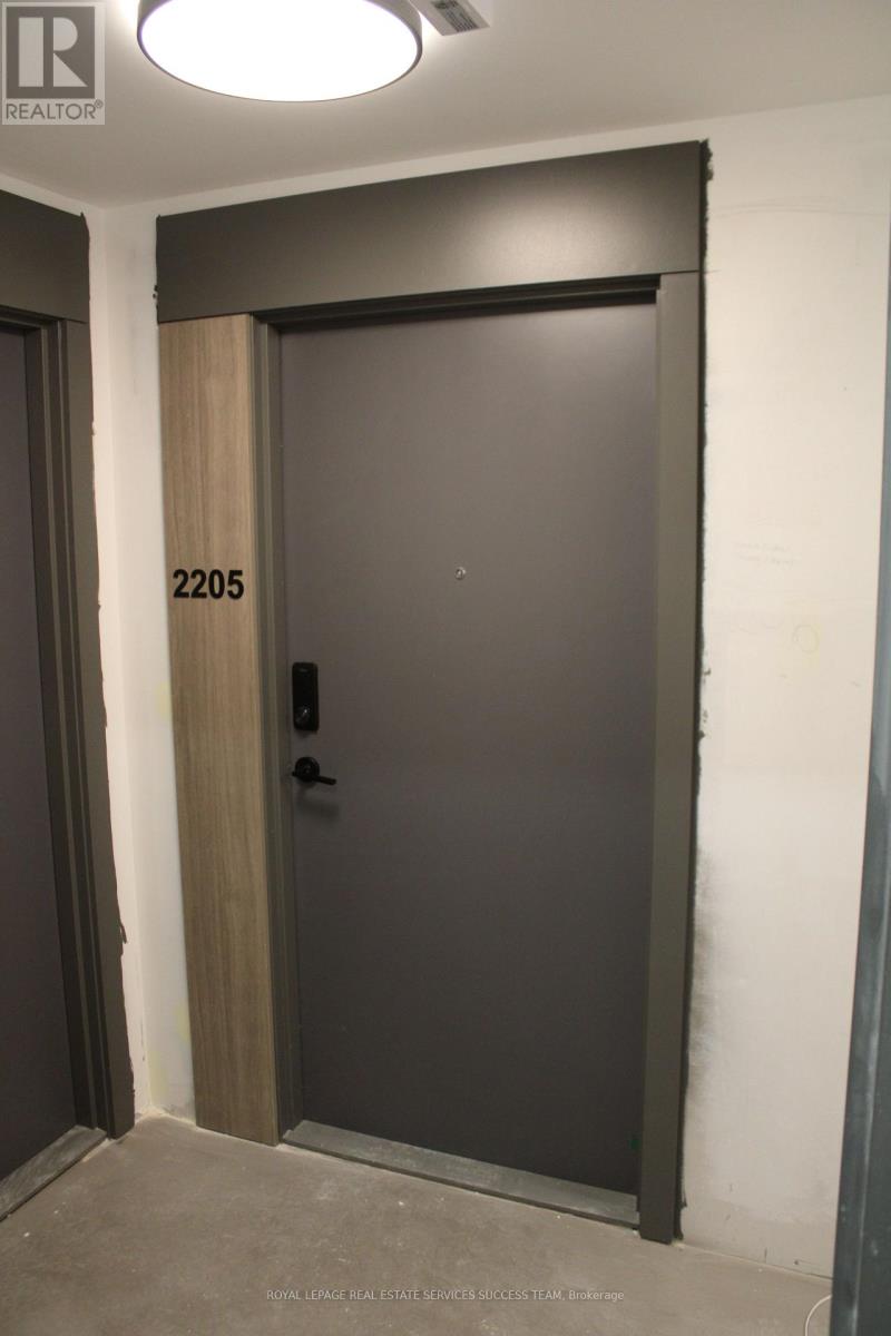 A door with a number 2205 on it is closed.