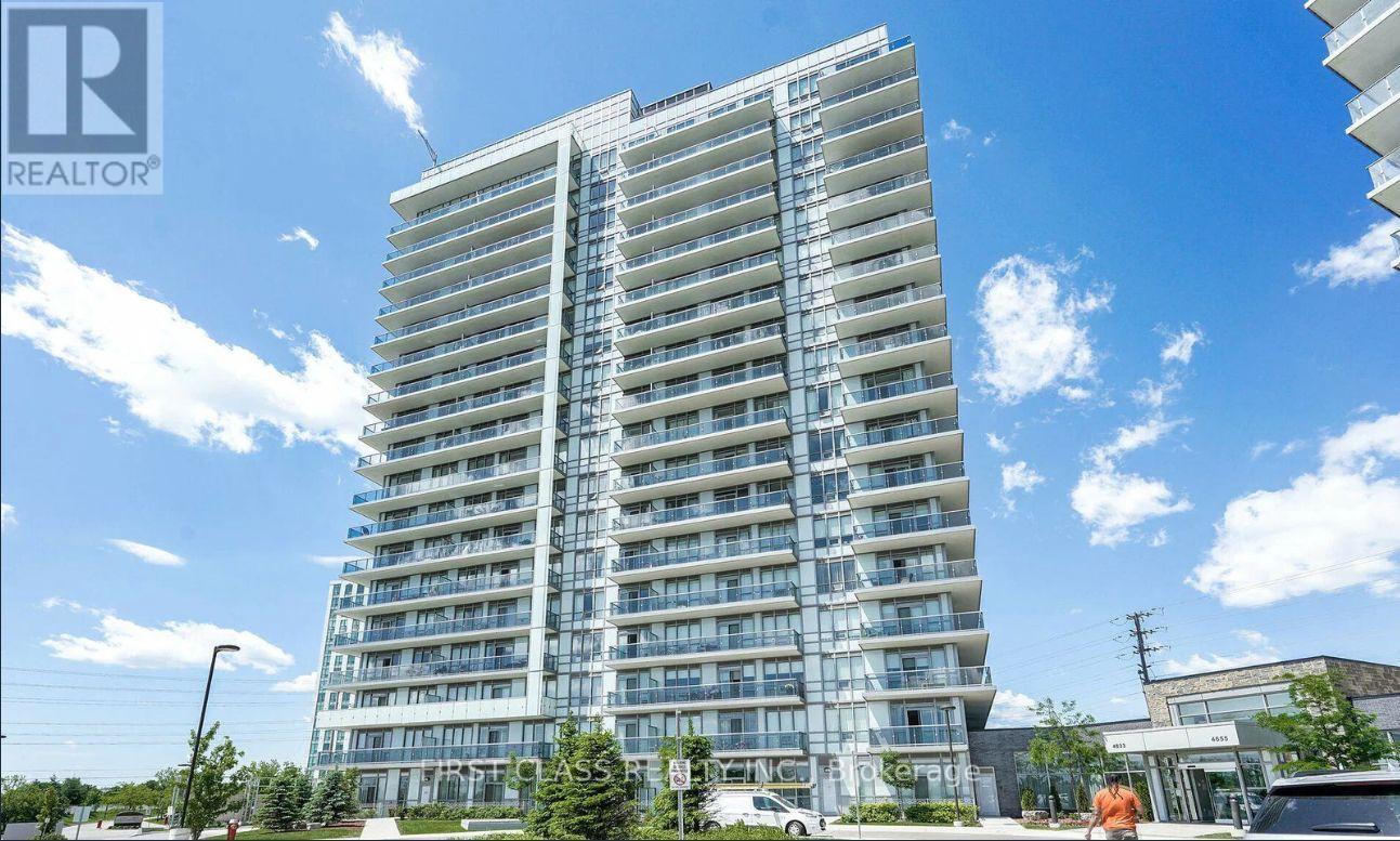 A tall residential building with many windows and balconies is shown.