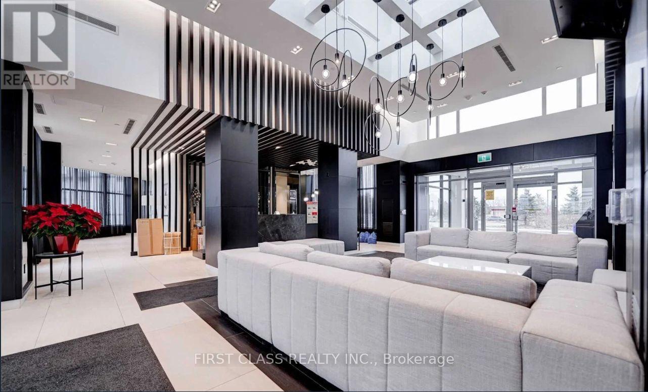 A modern living room with a large sofa and a glass wall.