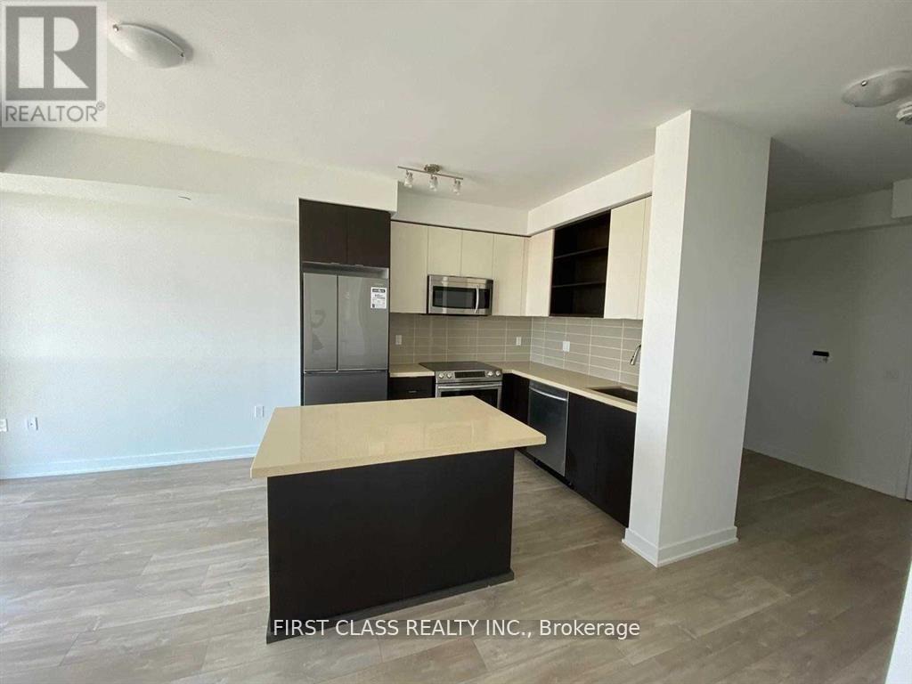 A kitchen with a countertop and cabinets in a real estate listing.