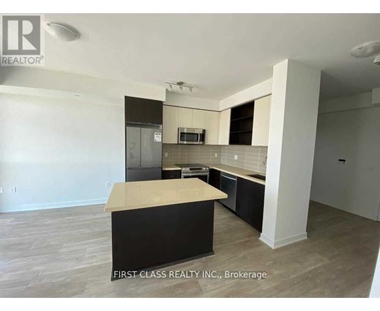 A kitchen with a countertop and cabinets in a real estate listing.