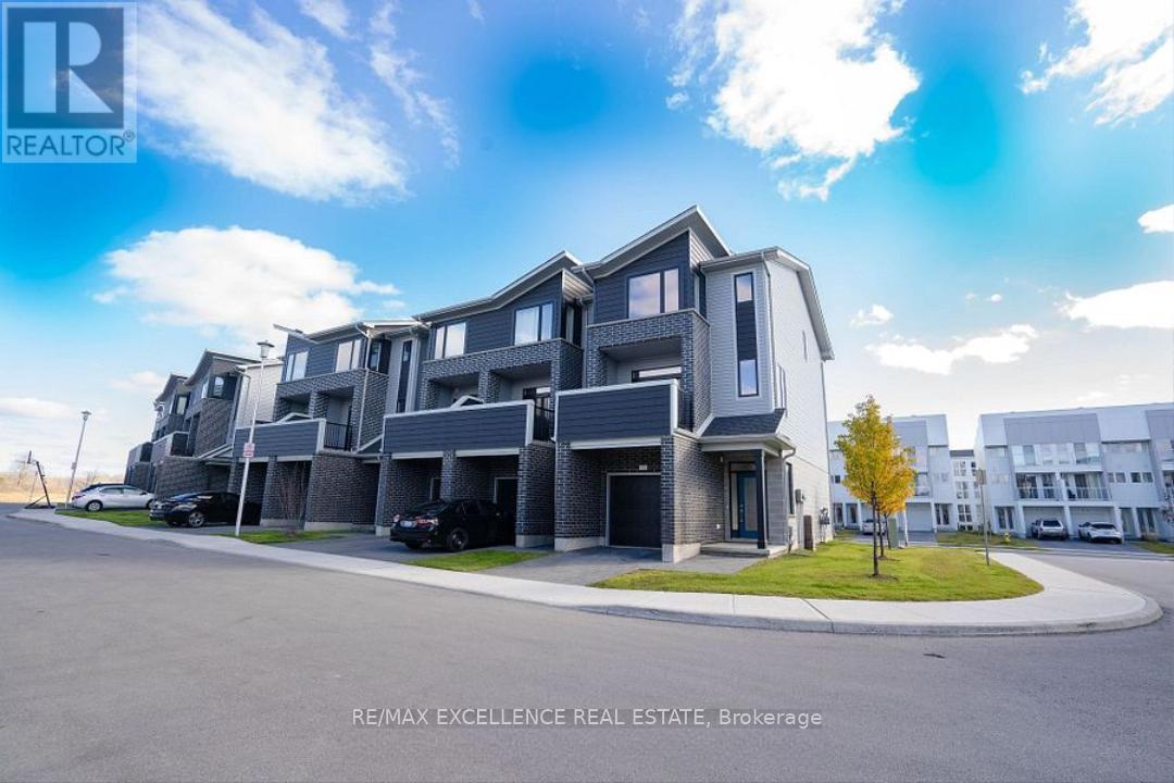 A modern apartment complex with a clear blue sky above.