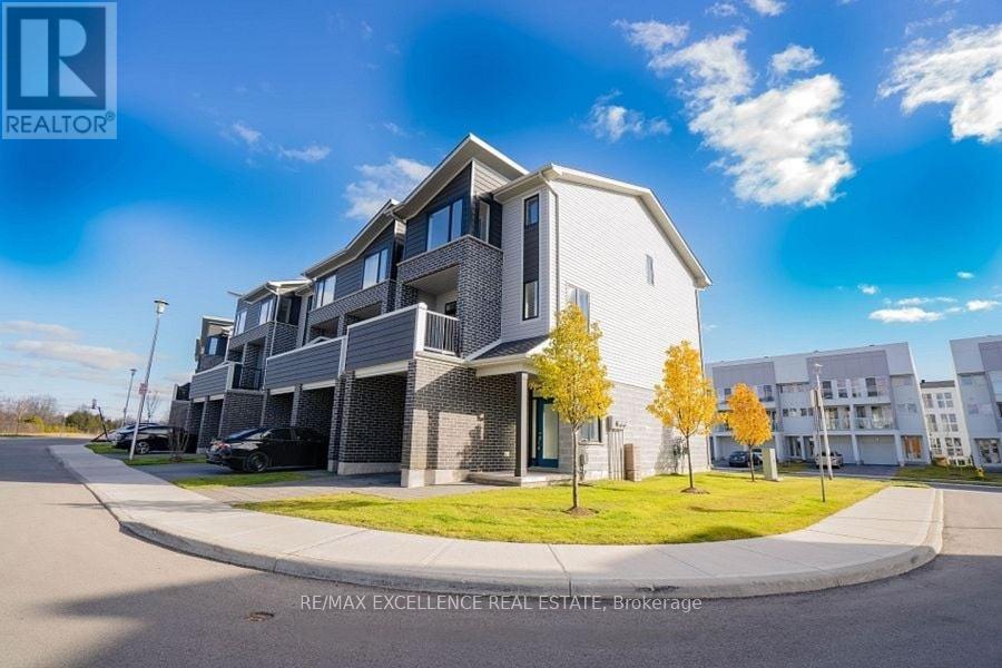 A modern apartment building with a clear blue sky above.