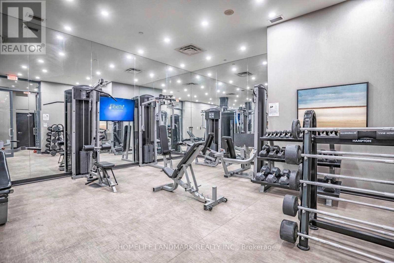 A well-equipped gym with a variety of machines and weights.